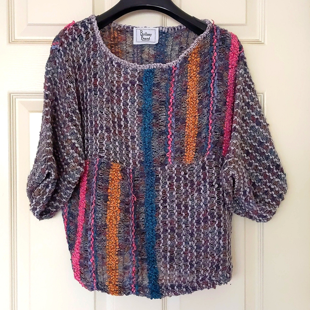 NWOT. Woman's Multi color half length big sleeve crochet sweater.